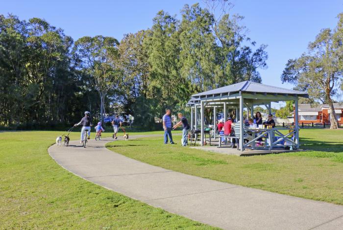 Kids and families at Long Jetty, using bike path and chairs and tables